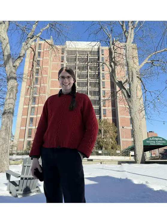 Jacob Deck posing in front of the housing authority unit